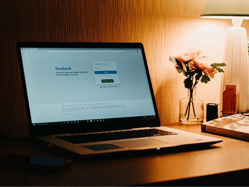 Image of a laptop opening Facebook.